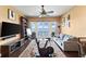 Media room with water views, exercise bike, and comfortable seating at 110 Driftwood Ln, Largo, FL 33770