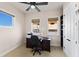 Home office with desk, chair, built-in shelving and window at 110 Driftwood Ln, Largo, FL 33770
