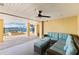 Relaxing waterfront patio with sectional sofa and ottomans at 110 Driftwood Ln, Largo, FL 33770