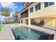 Inviting pool and spa with patio and waterfront views at 110 Driftwood Ln, Largo, FL 33770