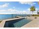 Resort-style pool and spa with waterfront views at 110 Driftwood Ln, Largo, FL 33770