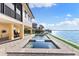 Relaxing pool and spa area overlooking the water at 110 Driftwood Ln, Largo, FL 33770