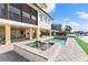Spacious pool and spa with patio and water views at 110 Driftwood Ln, Largo, FL 33770