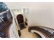 Elegant curved staircase leading to upper level entryway and foyer at 110 Driftwood Ln, Largo, FL 33770