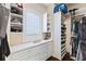 Large walk-in closet with ample shelving and drawers at 110 Driftwood Ln, Largo, FL 33770
