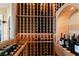 Well-stocked wine cellar with extensive shelving for bottles at 110 Driftwood Ln, Largo, FL 33770