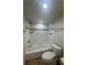 Clean bathroom with shower/tub combo and tile surround at 1100 N Shore Ne Dr # 403, St Petersburg, FL 33701