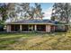 Brick home with screened porch and large backyard at 118 Laurel Tree Way, Brandon, FL 33511