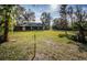 Large grassy backyard with lush landscaping at 118 Laurel Tree Way, Brandon, FL 33511