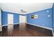 Serene bedroom with hardwood floors and blue walls at 118 Laurel Tree Way, Brandon, FL 33511