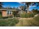 Brick home with well-manicured landscaping and large windows at 118 Laurel Tree Way, Brandon, FL 33511