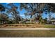 Ranch style brick home with lush lawn and mature shade trees at 118 Laurel Tree Way, Brandon, FL 33511