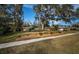 Brick house with landscaped yard and mature trees at 118 Laurel Tree Way, Brandon, FL 33511