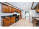 Kitchen with wood cabinets, granite counters, and stainless steel appliances at 118 Laurel Tree Way, Brandon, FL 33511
