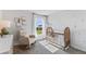 Bedroom with a crib, rocking chair, and palm tree wall decals at 17347 Wheatberry Blvd, Parrish, FL 34219