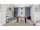 Home office with a desk, shelving unit, and neutral decor at 17347 Wheatberry Blvd, Parrish, FL 34219