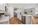 Modern kitchen with white cabinets, marble countertops, and stainless steel appliances at 17347 Wheatberry Blvd, Parrish, FL 34219