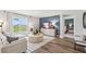 Open living space with sectional sofa and view into a bedroom at 17347 Wheatberry Blvd, Parrish, FL 34219