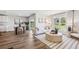 Spacious living room with hardwood floors, neutral decor, and large window at 17347 Wheatberry Blvd, Parrish, FL 34219