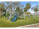 playground with slides, climbing structures, and swings at 1865 Nebraska Ne Ave, St Petersburg, FL 33703