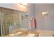 Bathroom with granite countertops, a shower, and bathtub at 1922 Echo Pond Pl, Wesley Chapel, FL 33543
