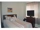 Bedroom with a queen-size bed, and a dresser at 1922 Echo Pond Pl, Wesley Chapel, FL 33543
