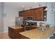 Spacious kitchen featuring granite countertops and stainless steel appliances at 1922 Echo Pond Pl, Wesley Chapel, FL 33543