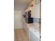 Laundry room with washer, dryer, and extra storage at 1922 Echo Pond Pl, Wesley Chapel, FL 33543
