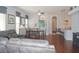 Open living space with hardwood floors, a dining area, and kitchen at 1922 Echo Pond Pl, Wesley Chapel, FL 33543