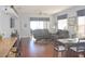 Open living space with hardwood floors, and access to the back patio at 1922 Echo Pond Pl, Wesley Chapel, FL 33543