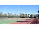 Well-lit tennis courts for community use at 1922 Echo Pond Pl, Wesley Chapel, FL 33543