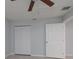 Bedroom with double door closet and ceiling fan at 235 Se Madison N Cir, St Petersburg, FL 33703