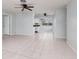 Open concept living and dining area with tile flooring at 235 Se Madison N Cir, St Petersburg, FL 33703