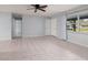 Spacious living room with tile floors and ceiling fan at 235 Se Madison N Cir, St Petersburg, FL 33703