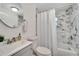 Clean bathroom with marble-look shower/tub combo and vanity at 2622 E Genesee St, Tampa, FL 33610