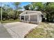 Newly renovated bungalow with a covered porch and a well-manicured front yard at 2622 E Genesee St, Tampa, FL 33610