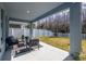 Covered patio with seating area and fenced backyard at 28818 Orange Berry Dr, Wesley Chapel, FL 33543