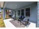 Spacious covered patio with comfortable seating area at 28818 Orange Berry Dr, Wesley Chapel, FL 33543