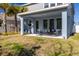 Private backyard with covered patio and landscape at 28818 Orange Berry Dr, Wesley Chapel, FL 33543