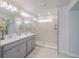 Elegant bathroom with double vanity and glass shower at 28818 Orange Berry Dr, Wesley Chapel, FL 33543