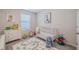 Adorable Bedroom with crib, playmat, and plenty of toys at 28818 Orange Berry Dr, Wesley Chapel, FL 33543