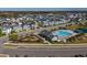 Aerial view of community pool, playground, and homes at 28818 Orange Berry Dr, Wesley Chapel, FL 33543