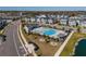 Aerial view of community pool with lounge chairs at 28818 Orange Berry Dr, Wesley Chapel, FL 33543