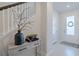 Entryway with console table, decor, and view of interior door at 28818 Orange Berry Dr, Wesley Chapel, FL 33543