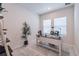 Bright home office features built-in shelving and large windows at 28818 Orange Berry Dr, Wesley Chapel, FL 33543