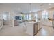 Open concept kitchen with island and wine cooler at 28818 Orange Berry Dr, Wesley Chapel, FL 33543