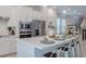 Modern kitchen with stainless steel appliances and white cabinetry at 28818 Orange Berry Dr, Wesley Chapel, FL 33543