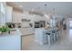Modern kitchen with white cabinets, island, stainless steel appliances, and open layout at 28818 Orange Berry Dr, Wesley Chapel, FL 33543