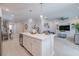 Open concept kitchen with island and seating at 28818 Orange Berry Dr, Wesley Chapel, FL 33543