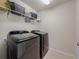 Modern laundry room featuring Samsung washer and dryer at 28818 Orange Berry Dr, Wesley Chapel, FL 33543